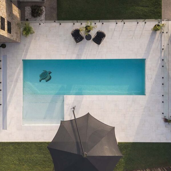 Bird’s eye view of stone look pool surrounds modern backyard tile Bundaberg Queensland