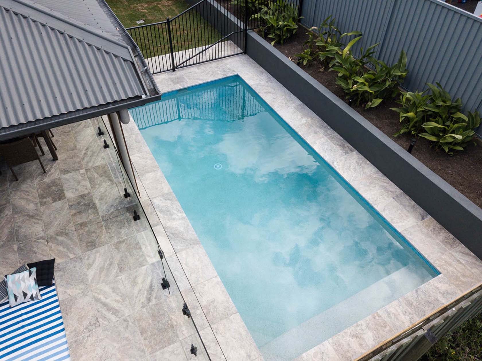 Silver Travertine pool coping and surround tiles